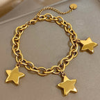 Armband met drie hangende sterren goud