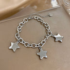 Armband met drie hangende sterren zilver