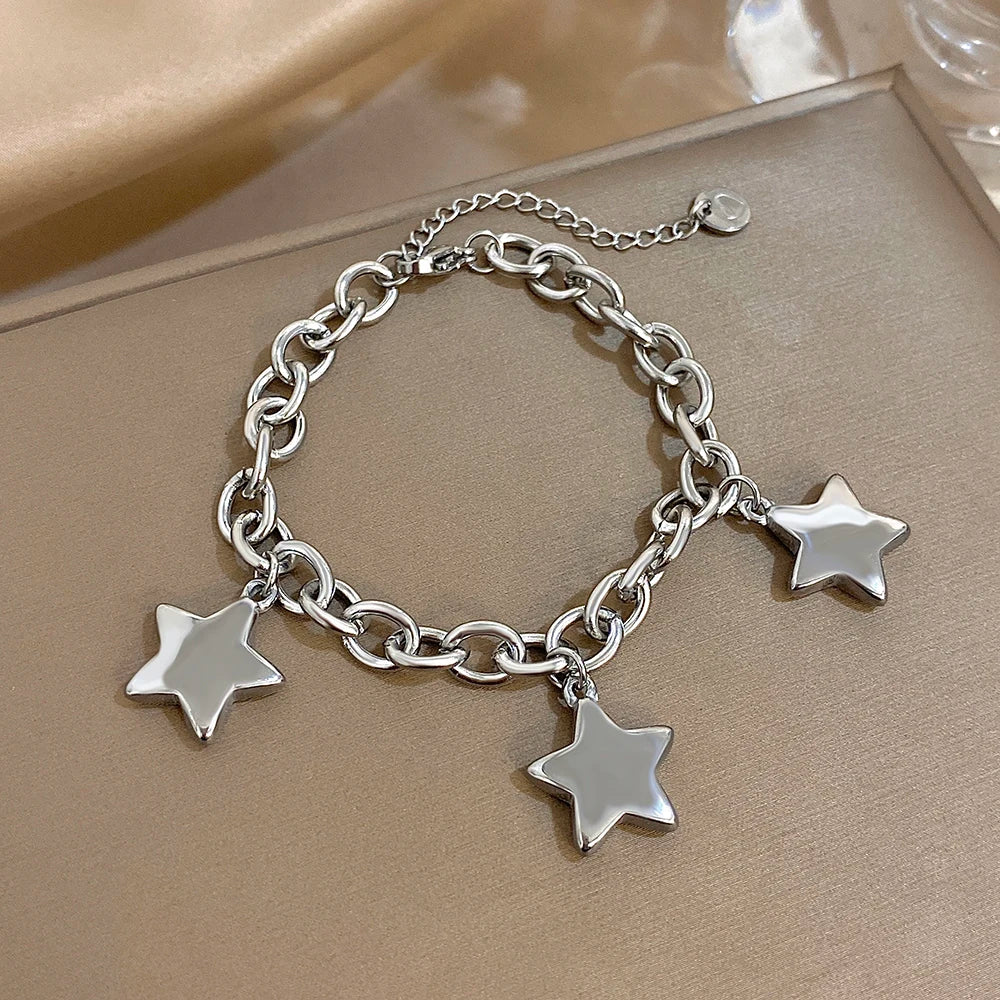 Armband met drie hangende sterren zilver