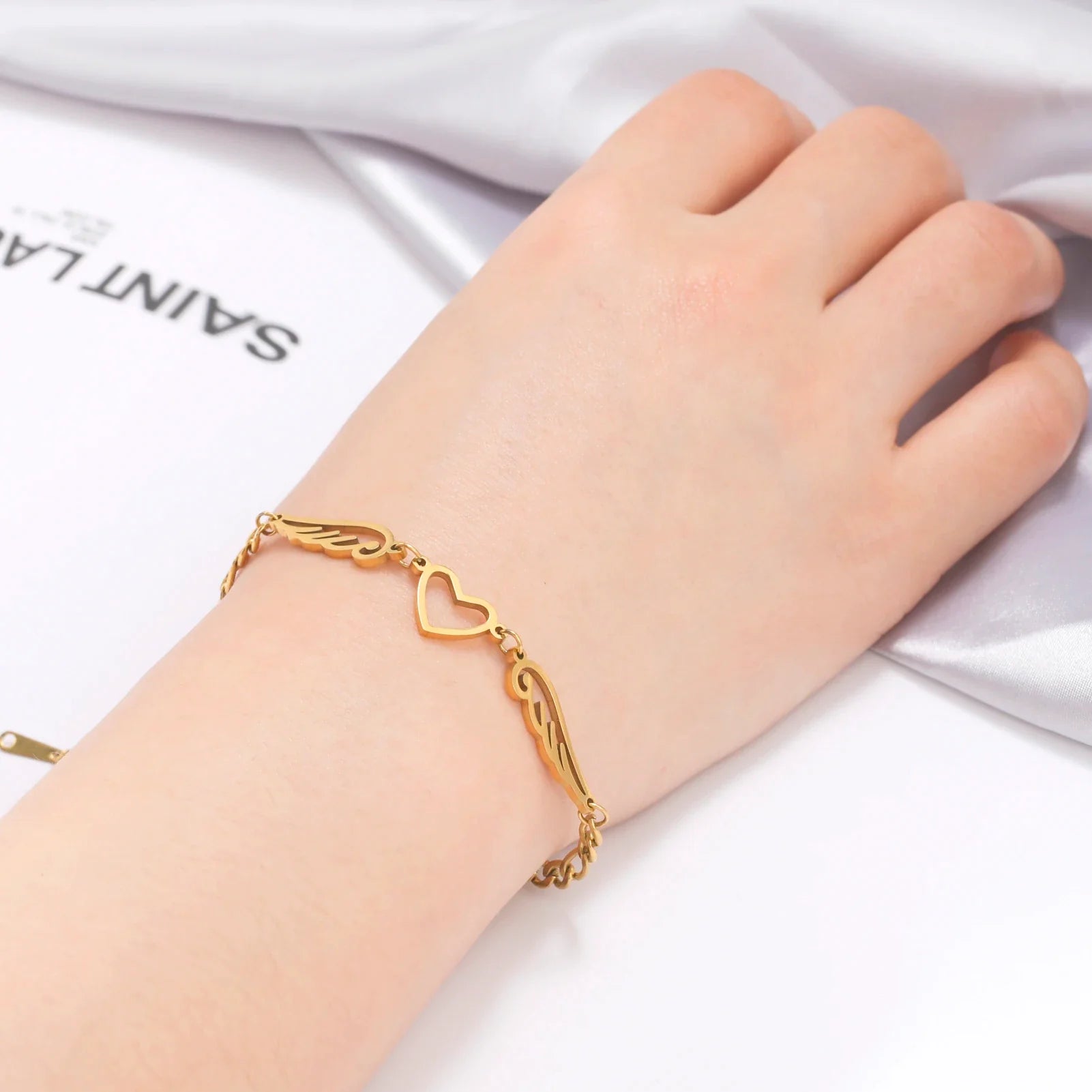 Armband hart en engelenvleugels goud