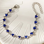 Armband met geëmailleerde hartjes zilver en blauw