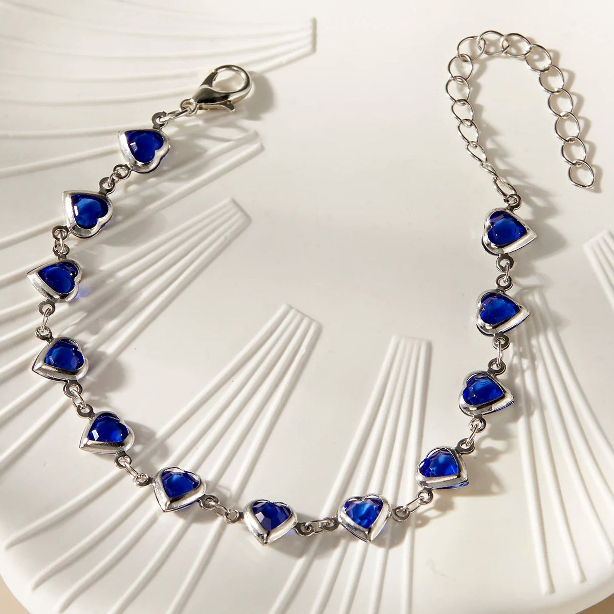 Armband met geëmailleerde hartjes zilver en blauw