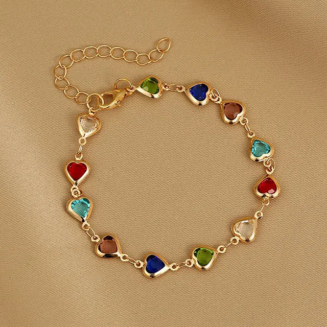 Armband met geëmailleerde hartjes goud en veelkleurig