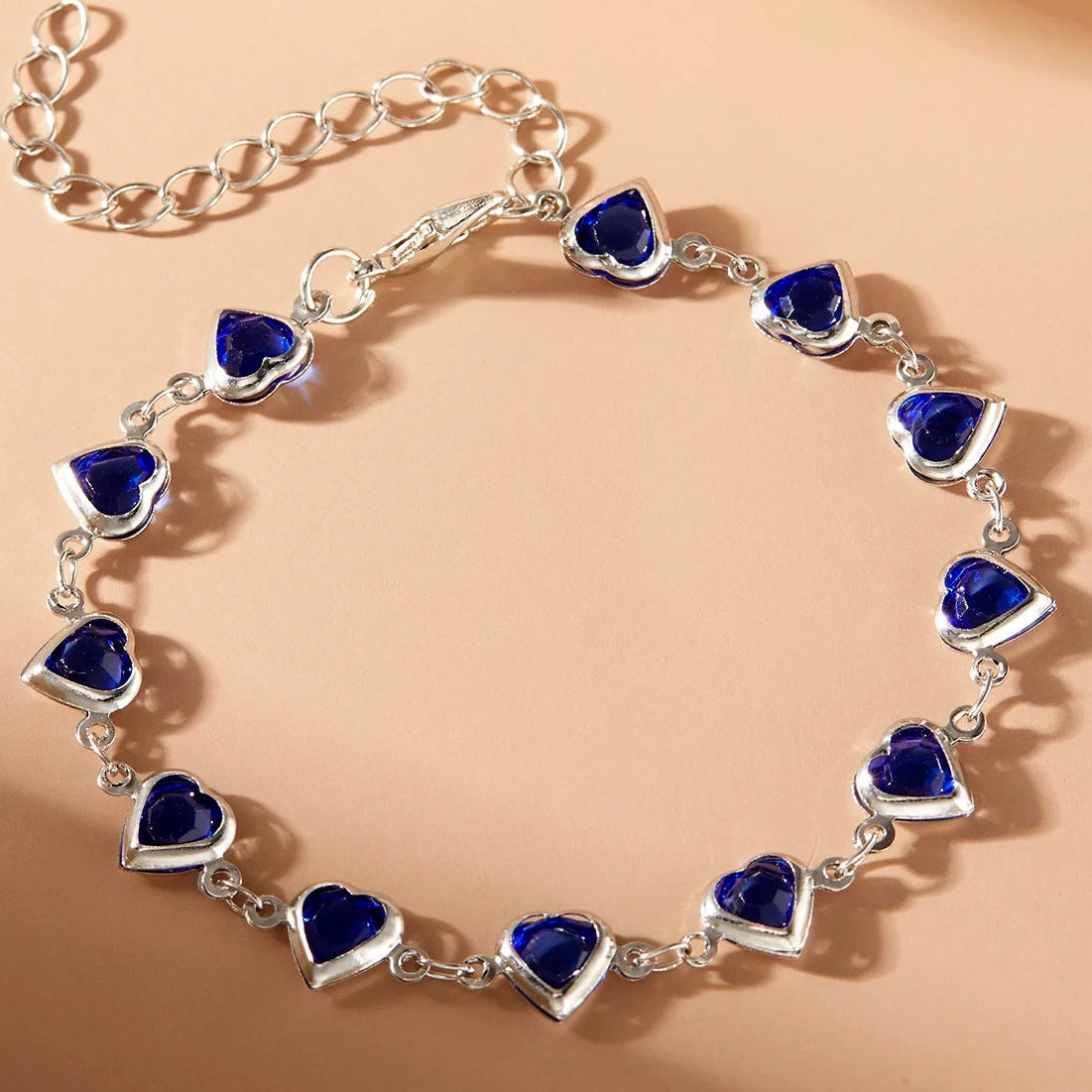 Armband met geëmailleerde hartjes zilver en blauw