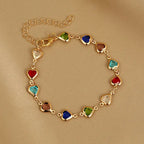 Armband met geëmailleerde hartjes goud en veelkleurig
