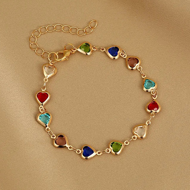 Armband met geëmailleerde hartjes goud en veelkleurig