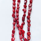 Armband van rood koraal in kiezelvorm