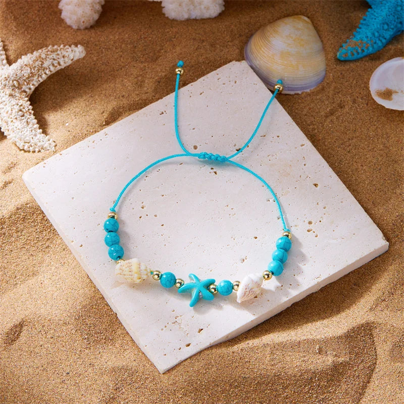 Koordarmband met schelp en blauwe zeester