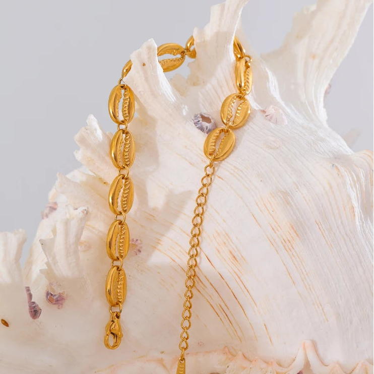 Vergulde armband met kauri-schelp