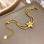 Armband met dubbele rij en bolle ster goud