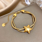 Armband met dubbele rij en bolle ster goud