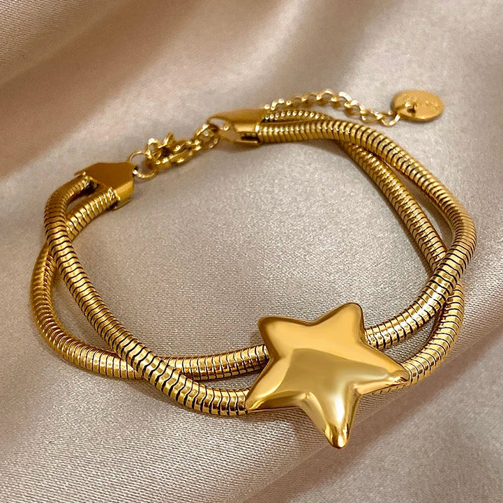 Armband met dubbele rij en bolle ster goud
