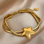 Armband met dubbele rij en bolle ster goud