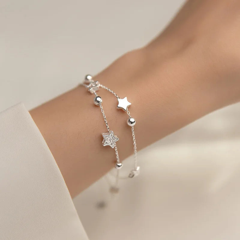 Dubbele armband met zilverkleurige sterren