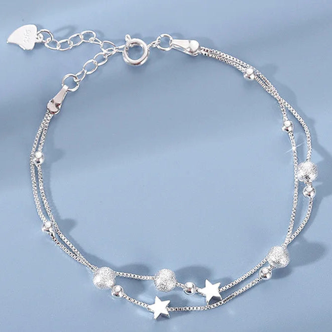 Dubbele armband met sterren en gezandstraalde kralen