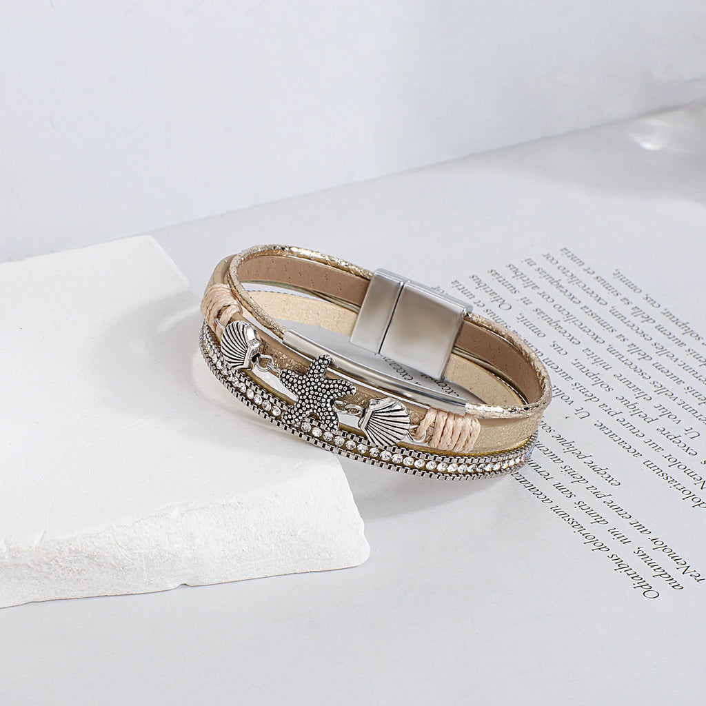 Armband van leer met schelp en zeester in witgoud