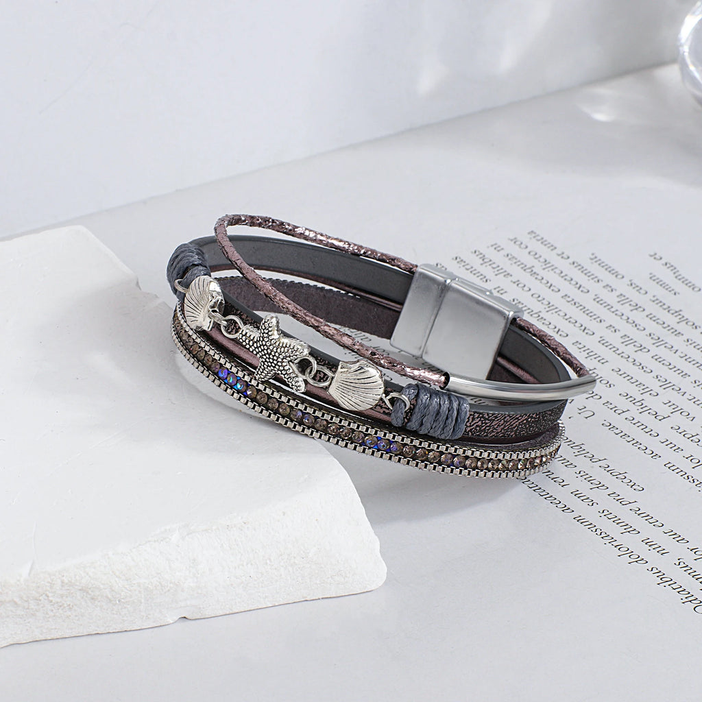 Armband van leer met schelp en zeester in grijs