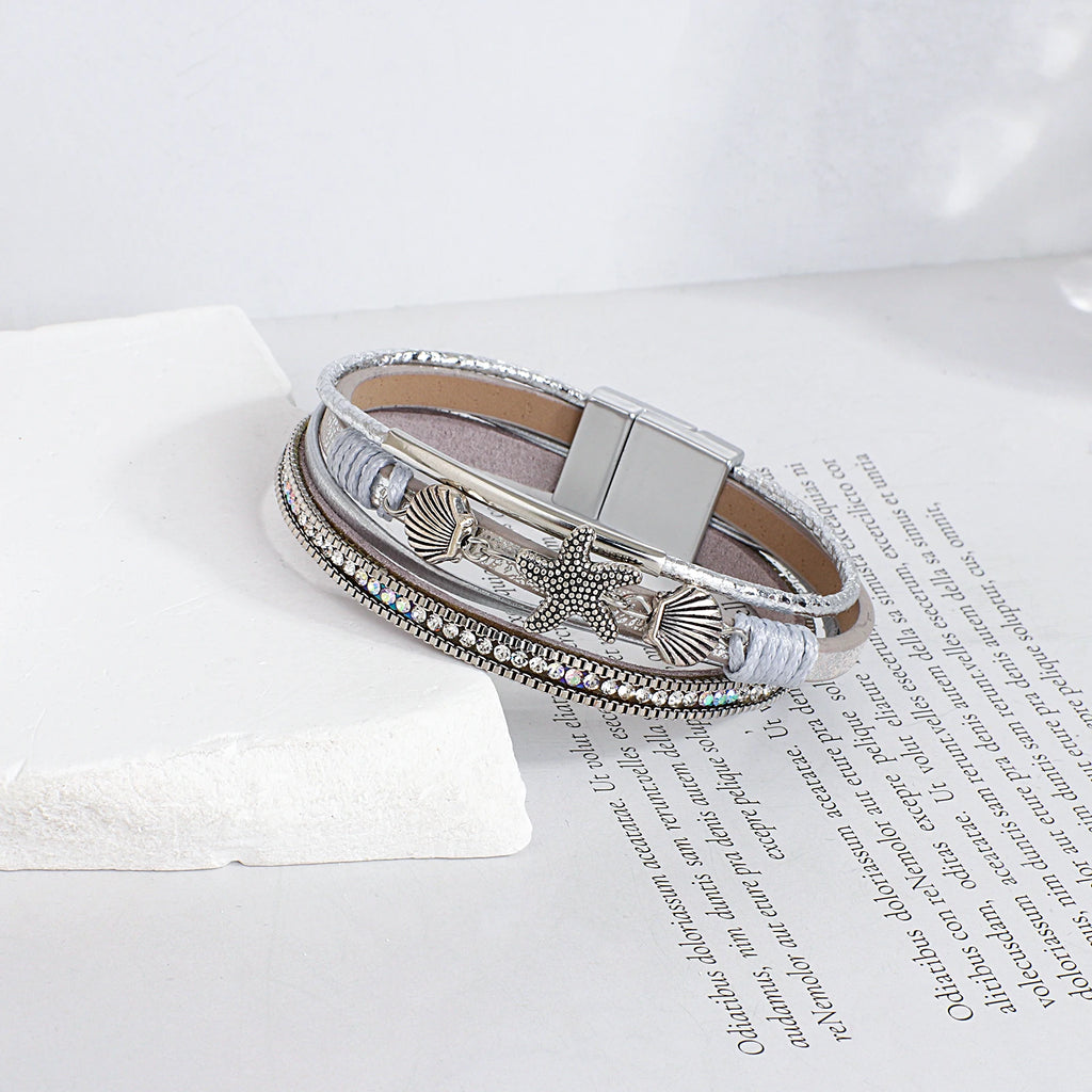 Armband van leer met schelp en zeester in zilver