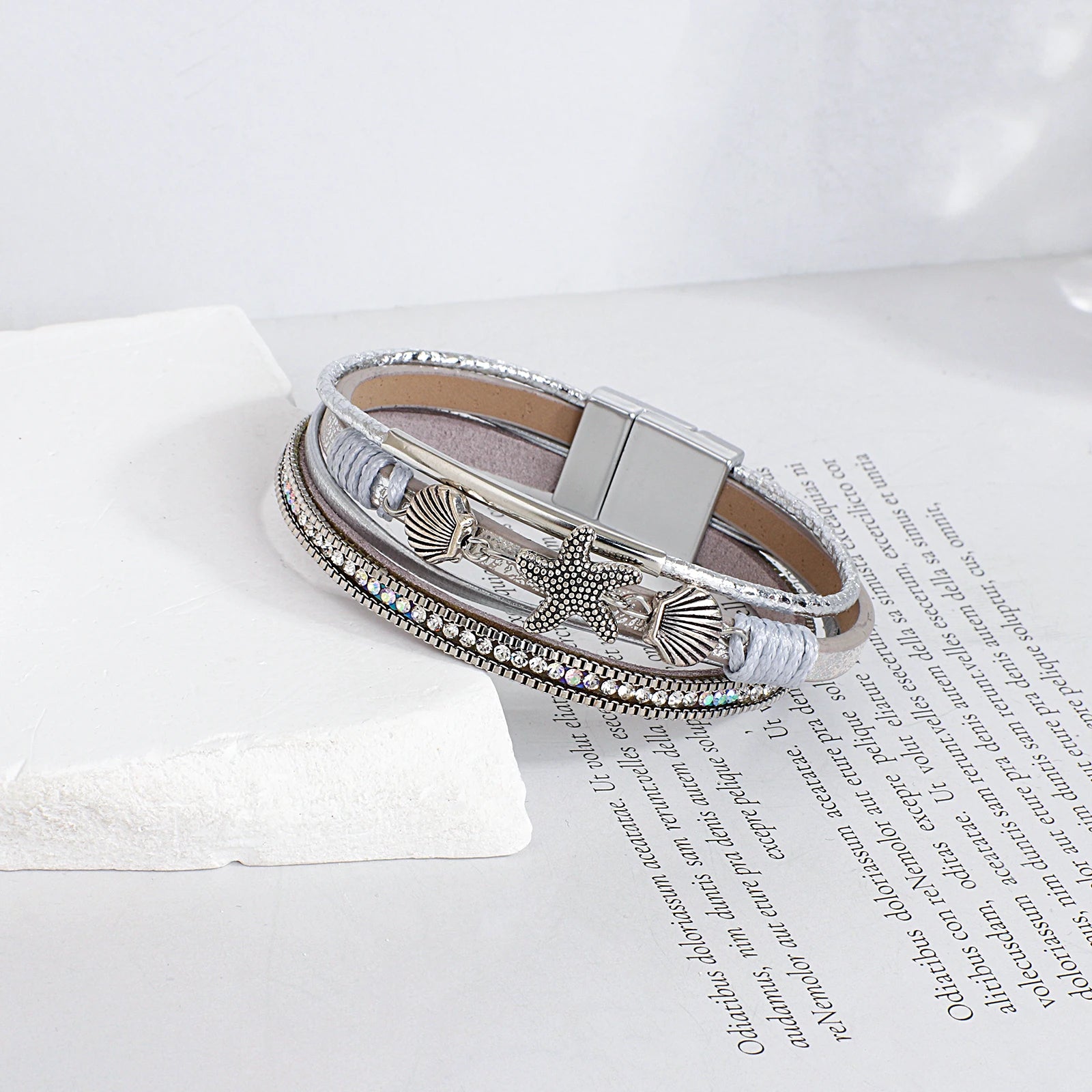 Armband van leer met schelp en zeester in zilver