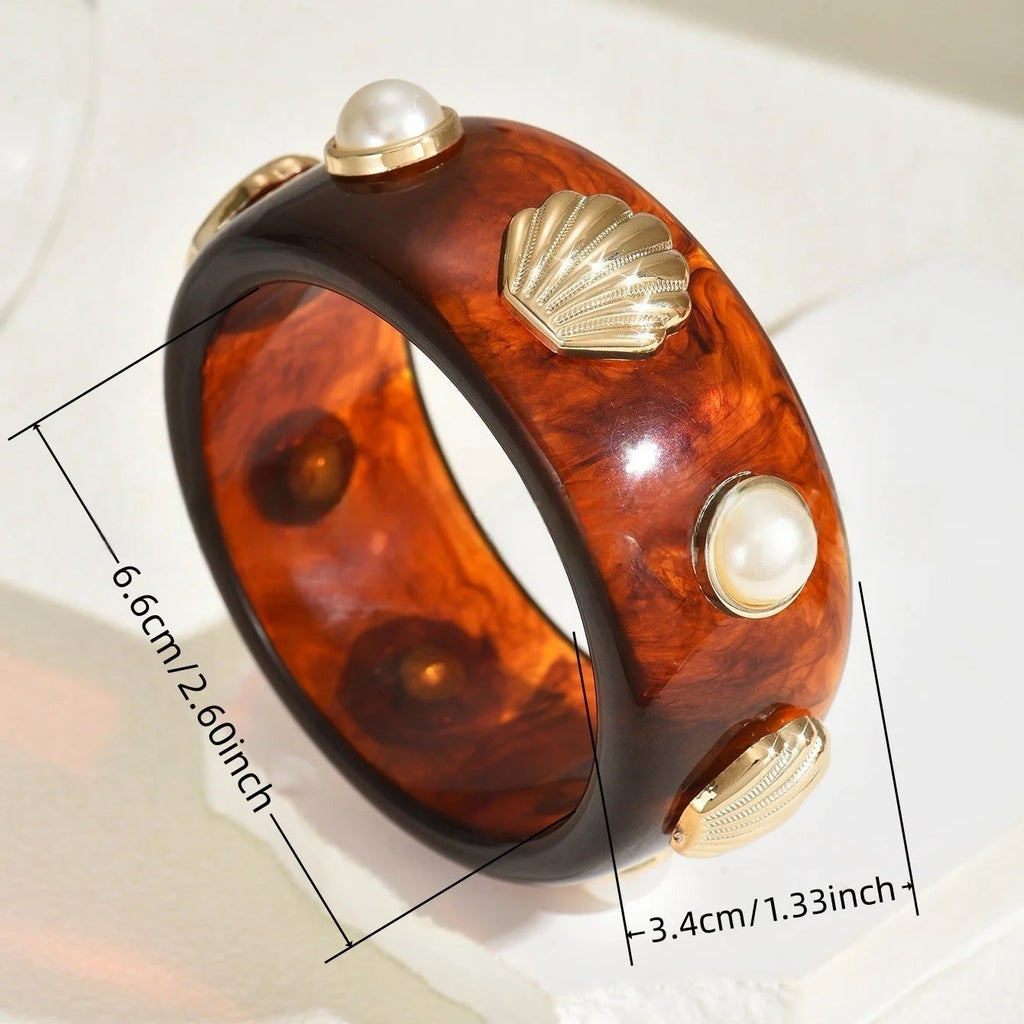Armband van hars met schelp