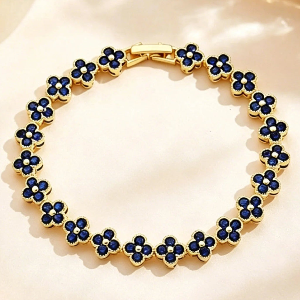 Armband met meerdere klavertjes van gekleurde kristallen goud en blauw