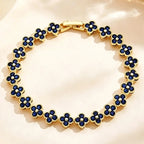 Armband met meerdere klavertjes van gekleurde kristallen goud en blauw