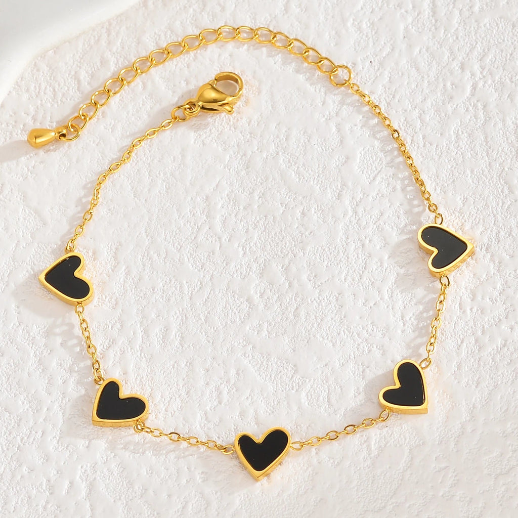 Armband met kleurenstaal van zwarte hartjes