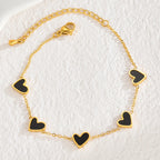 Armband met kleurenstaal van zwarte hartjes