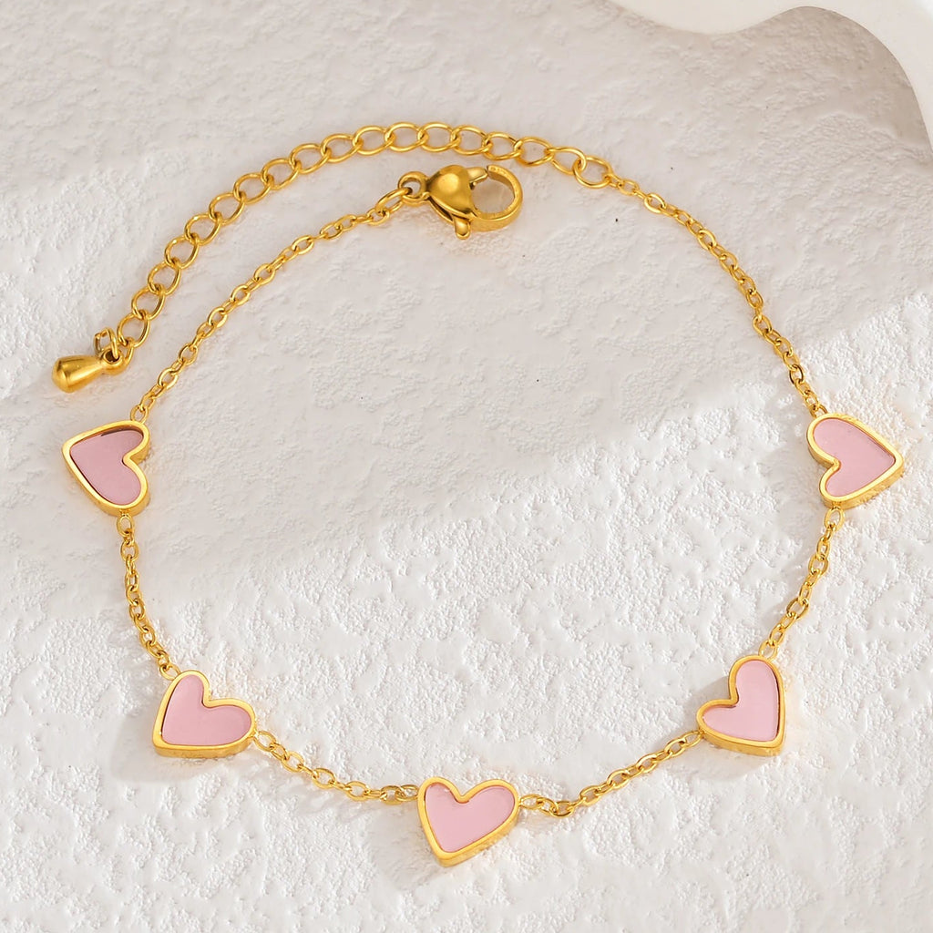 Armband met kleurenstaal van roze hartjes