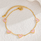 Armband met kleurenstaal van roze hartjes