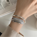 Zilverkleurige veerarmband voor dames