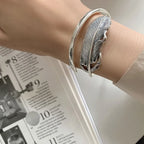 Zilverkleurige veerarmband voor dames