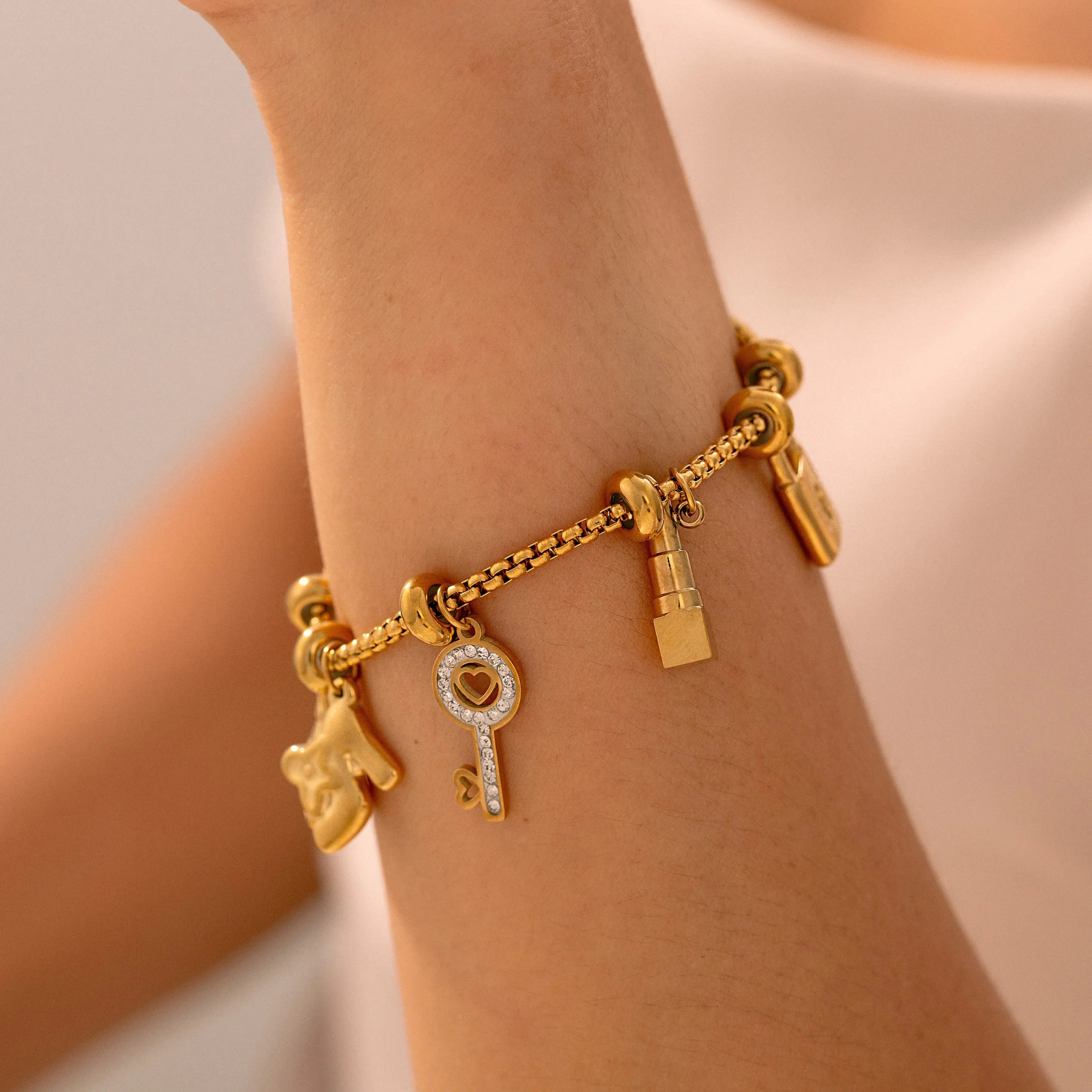 Damesarmband met sleutels en sloten, goud