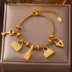 Damesarmband met sleutels en sloten, goud