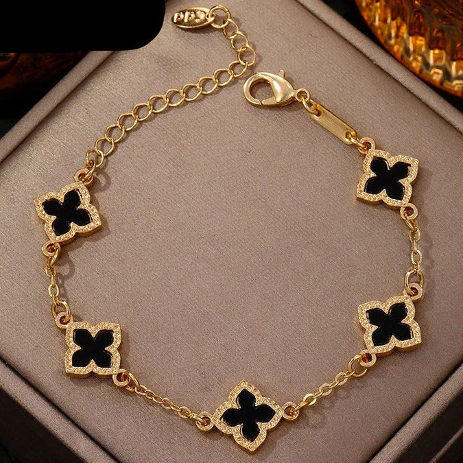 Armband met klavertjevier met parelmoereffect zwart