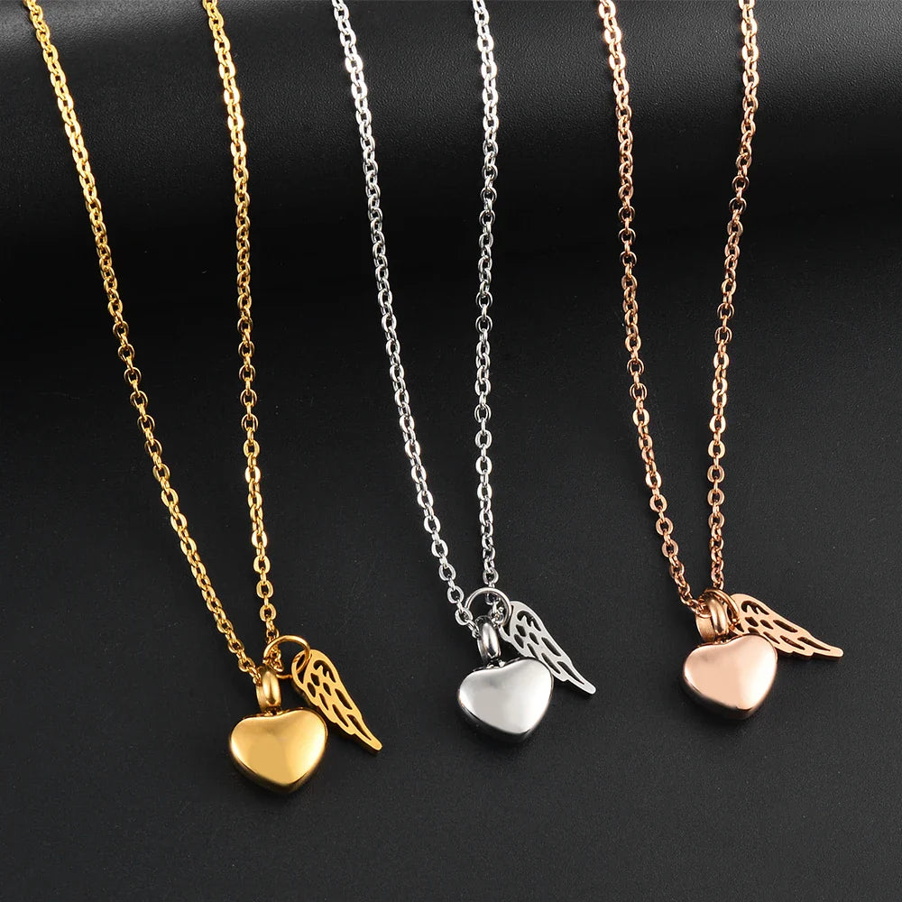 Urnenketting met hanger van engelenvleugels en hart goud