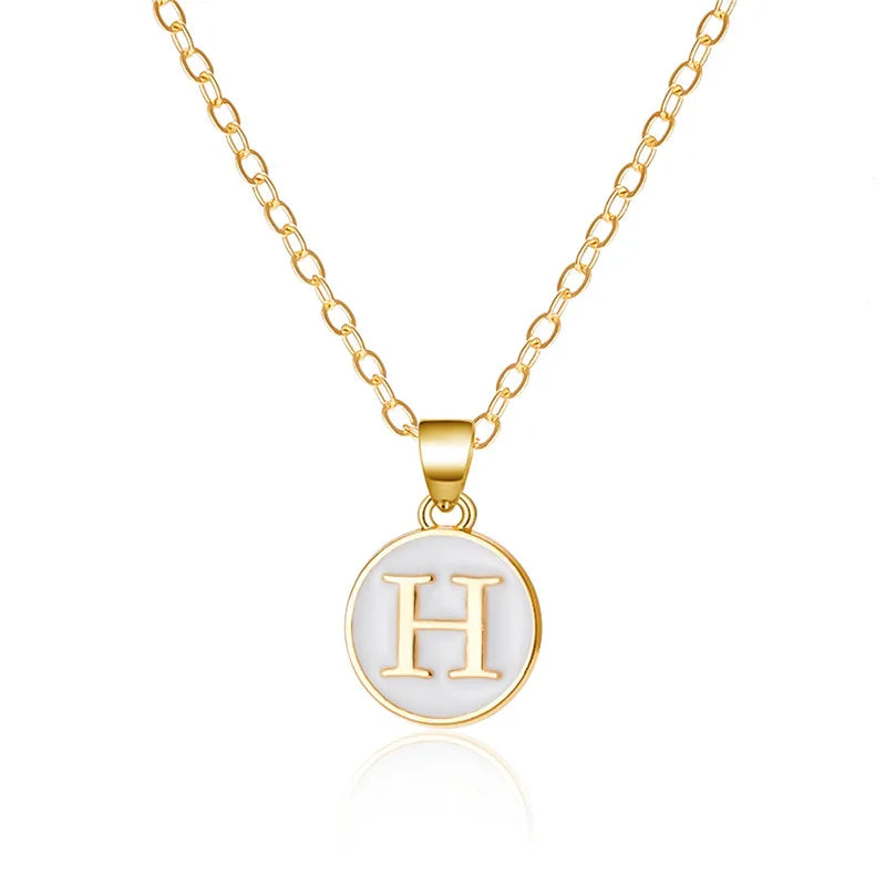 Halsketting met witte hanger initiaal h