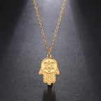 Halsketting met beschermend hangertje <span data-glossary-id="etoile-de-david">Davidster</span> en Fatma-hand in goud