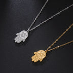 Halsketting met beschermend hangertje <span data-glossary-id="etoile-de-david">Davidster</span> en Fatma-hand in goud