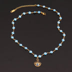 Collier en Perles avec Pendentif Oeil Bleu Style 1