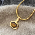 Ketting met hanger van ovale tijgeroogsteen