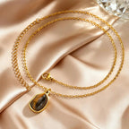 Ketting met geometrische hanger en tijgeroogsteen