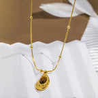Ketting met waterdruppelvormige hanger van natuurlijke tijgeroogsteen