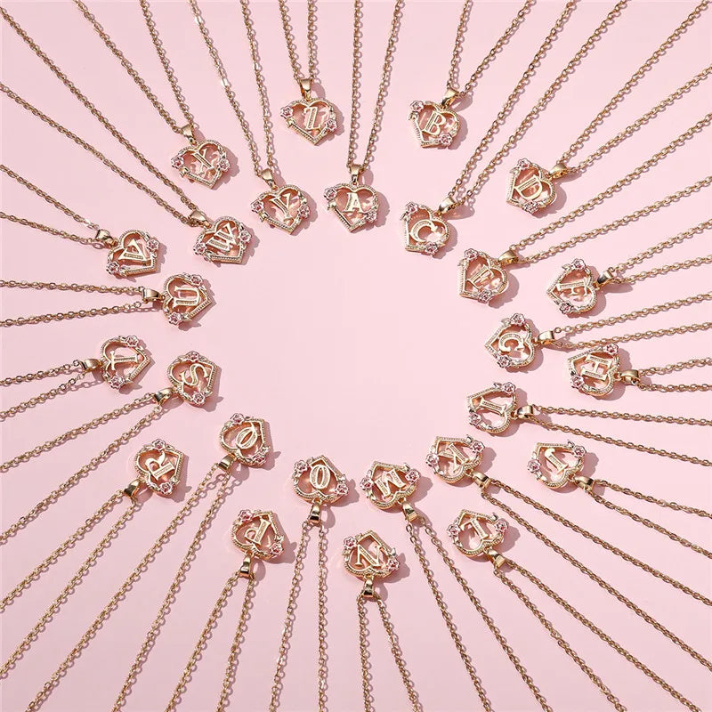 Halsketting met hart- en bloemeninitiale hanger