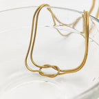 Halsketting met minimalistische knoophanger goud