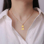 Ketting met palmboom- en strandgolfhanger goud