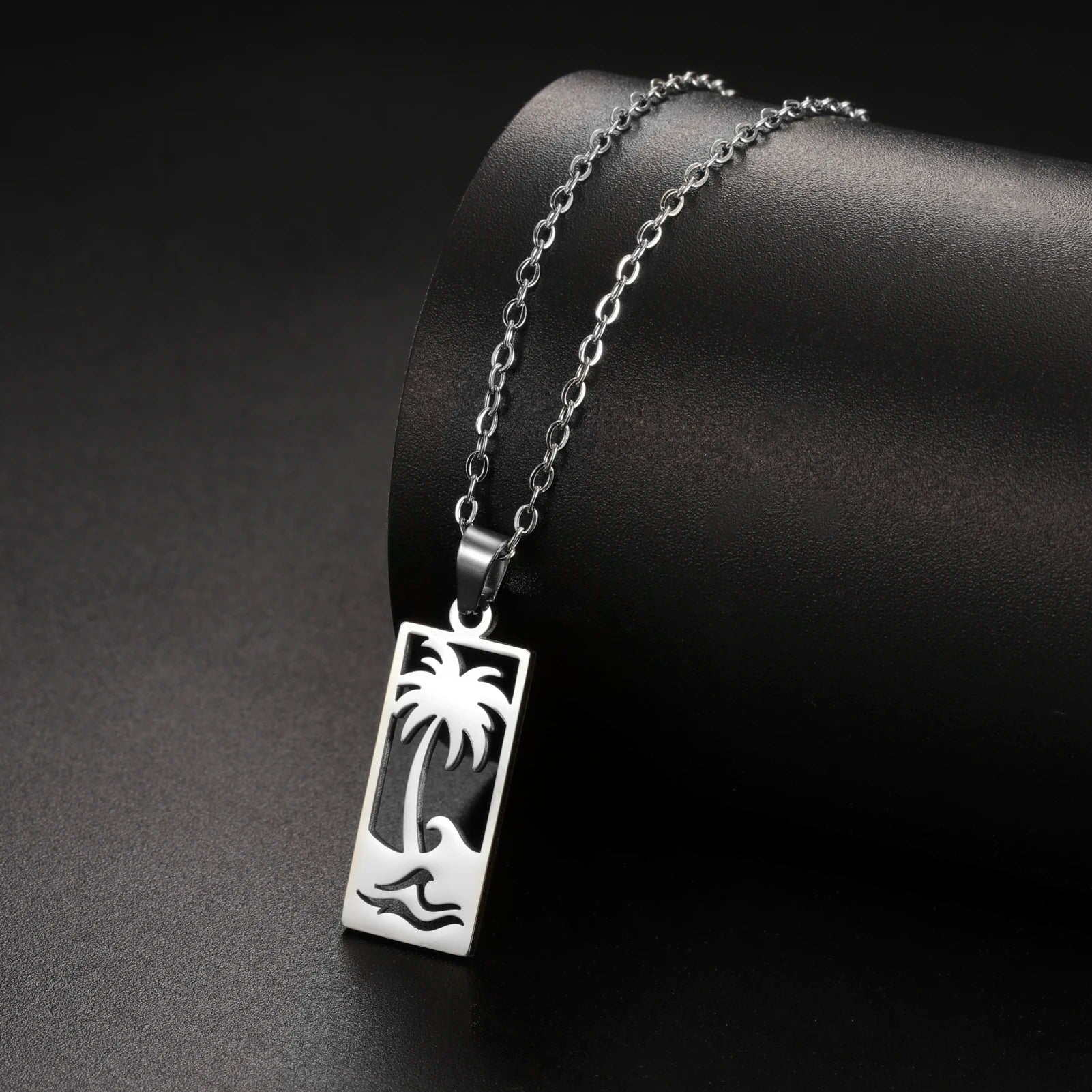 Ketting met palmboom- en strandgolfhanger zilver
