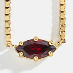 Ketting met oogvormige hanger met geboortesteen januari
