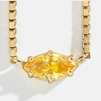 Ketting met oogvormige hanger met geboortesteen november