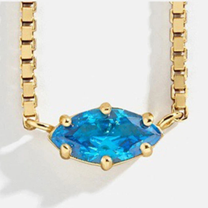 Ketting met oogvormige hanger met geboortesteen december